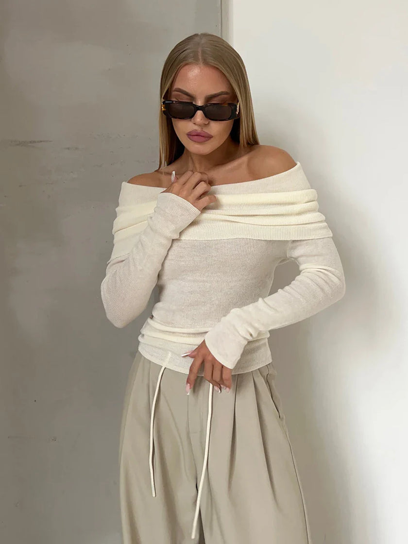 FJØRNA women's ribbed knit off-shoulder top, showing a close-up of the fitted, textured fabric and off-shoulder neckline.