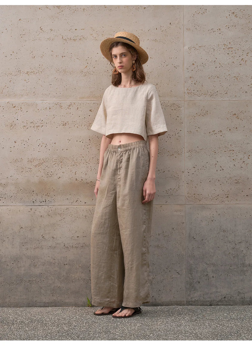 FJØRNA women's linen crop top with short sleeves, lightweight and breathable fabric, casual style perfect for warm weather.