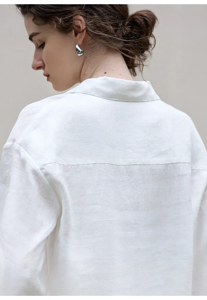 FJØRNA women's linen polo top with collar, lightweight and breathable, shown in a close-up of the collar and fabric texture.