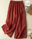 FJØRNA women's lightweight summer trousers with wide leg design, breathable and flowy fabric, perfect for warm weather.