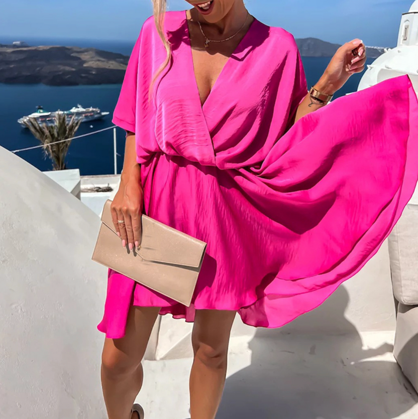 FJØRNA stylish summer mini dress, casual wedding dress with lightweight fabric and sleeveless design, perfect for warm weather events.