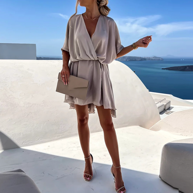 FJØRNA stylish summer mini dress, casual wedding dress with a lightweight, flowy fabric and sleeveless design for warm weather.