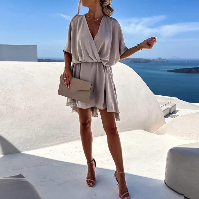 FJØRNA stylish summer mini dress, casual wedding dress with a lightweight, flowy fabric and sleeveless design for warm weather.