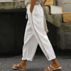 FJØRNA linen summer trousers for women, high waist tapered breathable pants, shown in light fabric with a relaxed fit.