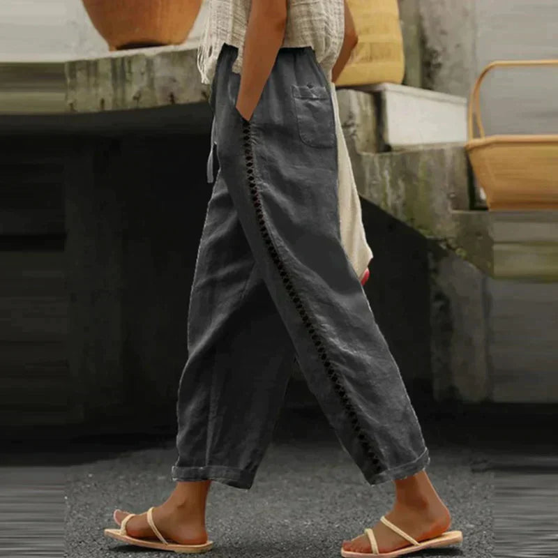 FJØRNA linen summer trousers for women, high waist tapered design, breathable fabric, suitable for warm weather and casual wear.