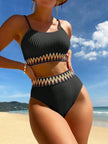 Women's black chevron bikini set by FJØRNA, high-waist retro swimwear with spaghettiträger and structured fabric, two-piece design.