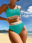 Women's black chevron bikini set with retro high-waist, strappy top, and structured fabric from FJØRNA swimwear collection.