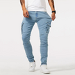 FJØRNA men's cargo pants in denim with 4-way stretch, versatile casual look, featuring multiple pockets and relaxed fit.