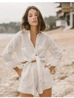Extra-large linen shirt by FJØRNA with spacious pockets, shown in natural fabric texture and relaxed fit style.