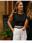 FJØRNA women’s linen crop top featuring a lightweight, breathable design with a relaxed fit and natural fabric texture.