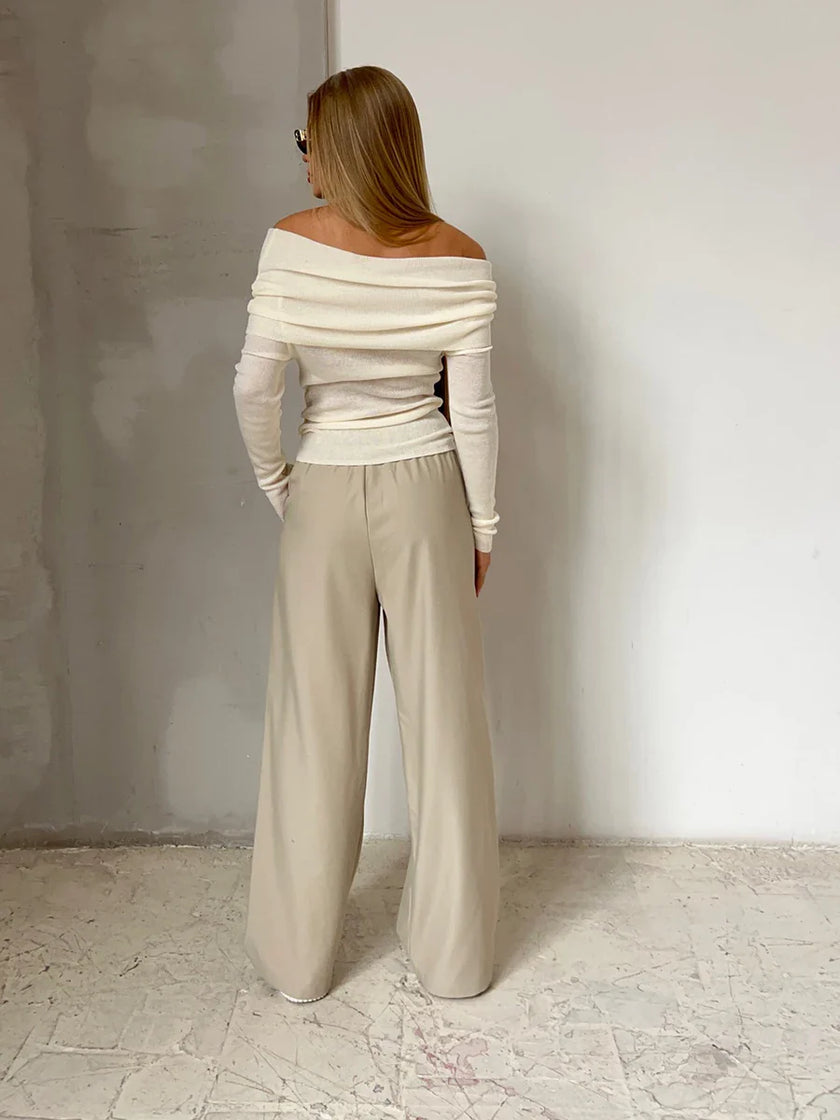 FJØRNA women's off-shoulder ribbed knit top, showcasing the fitted, textured fabric and stylish neckline design.