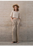 FJØRNA women's linen crop top with short sleeves, lightweight and breathable, shown in a natural relaxed fit.