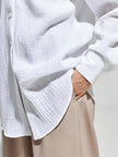 Lacceti Valencia 100% cotton summer shirt displayed on a hanger, featuring a lightweight, breathable fabric in a stylish design.