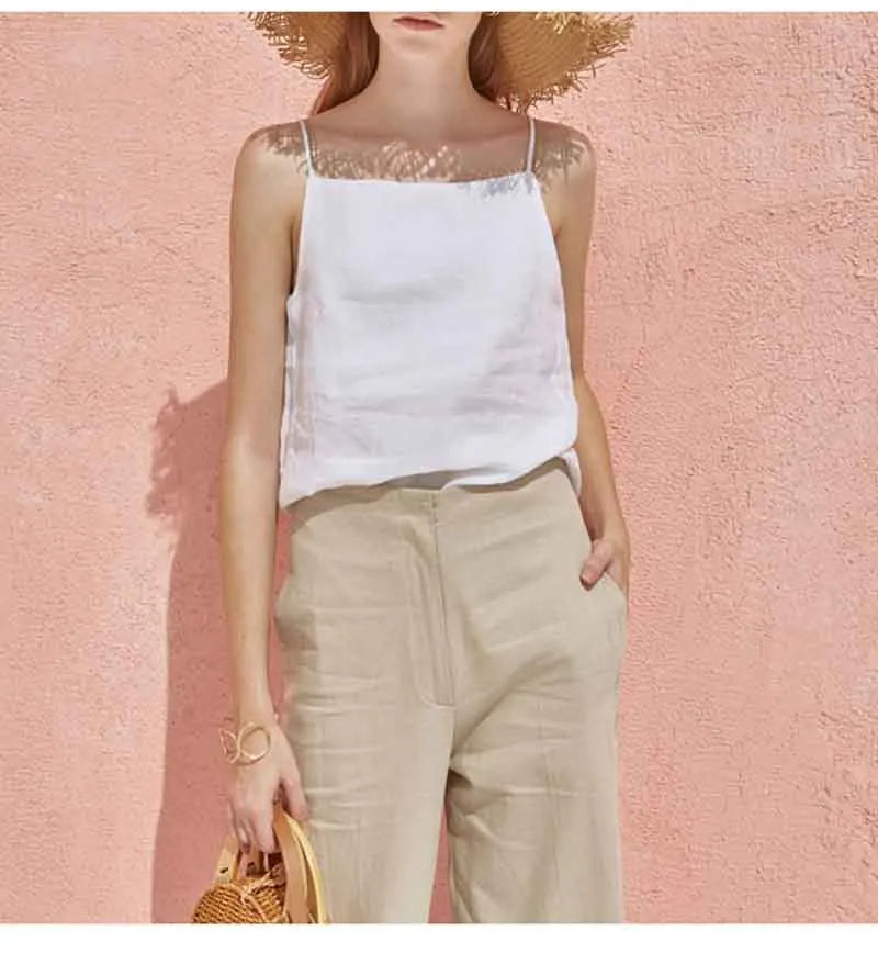 FJØRNA satin-trimmed linen cami top with delicate straps and soft, lightweight linen fabric, shown in a neutral color.