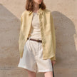 Extra-large linen shirt by FJØRNA with spacious pockets, shown in a natural fabric texture and relaxed fit style.