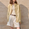 Extra-large linen shirt by FJØRNA with spacious pockets, shown in a natural fabric texture and relaxed fit style.