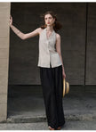 FJØRNA linen waistcoat for women in halter neck style, sleeveless top with a relaxed fit, ideal for casual and summer outfits.