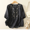 FJØRNA women's cotton blouse with V-neck, featuring a relaxed fit and soft fabric, perfect for casual or office wear.