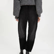 FJØRNA women's denim jeans with a relaxed barrel leg fit, showcasing classic blue denim and stylish casual design.