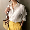 FJØRNA women's linen shirt with open collar, lightweight and breathable top, shown in a relaxed fit style.
