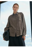 Women’s linen blend shirt by FJØRNA, showing a lightweight, casual top with a relaxed fit and natural fabric texture.
