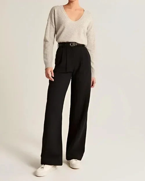 FJØRNA women's wide-leg high-waist trousers with relaxed fit, stylish pants featuring a comfortable waistband and flowing silhouette.