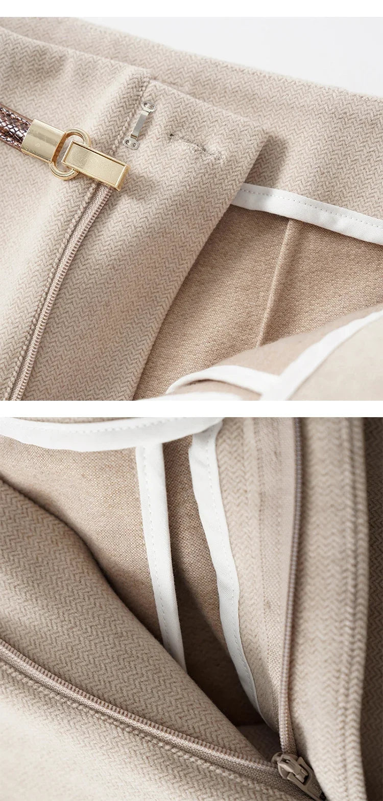 Women's wide-leg wool trousers by FJØRNA featuring high waist and tailored fit, shown in a stylish, neutral color.