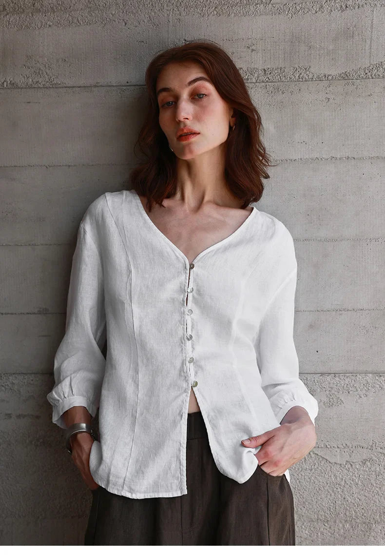 FJØRNA tailored V-neck linen top in neutral color, featuring a relaxed fit and lightweight fabric for casual wear.
