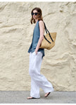 FJØRNA women's linen waistcoat with halter neck and sleeveless design, stylish top perfect for casual or summer wear.