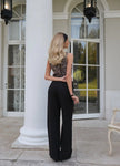 Women’s linen blend wide leg trousers by FJØRNA, high waist and stylish for casual or professional wear.