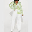 FJØRNA satin blouse for women featuring a smooth, elegant design with long sleeves and a classic collar, ideal for stylish wear.