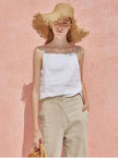 FJØRNA satin-trimmed linen cami top with delicate straps and soft fabric, perfect for casual or sleepwear styles.