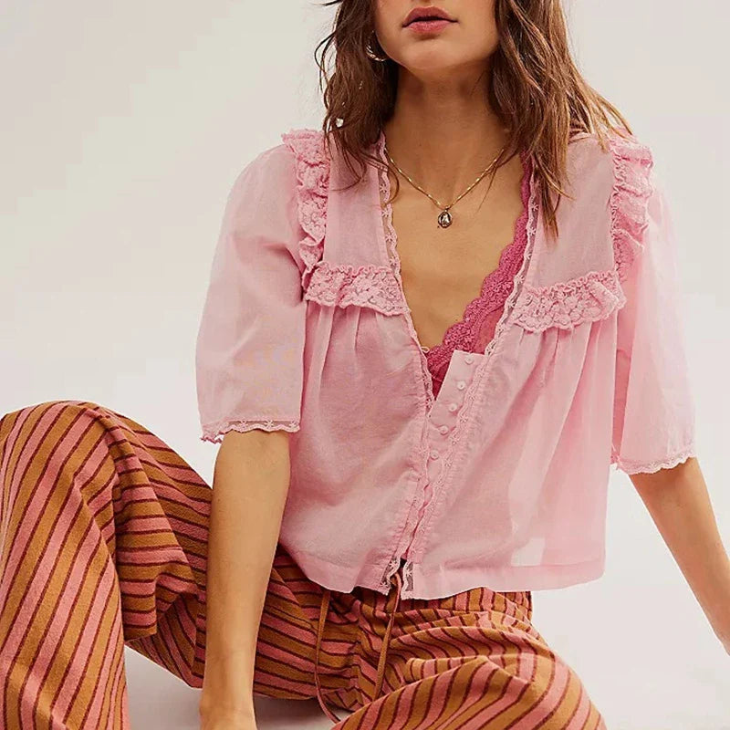 FJØRNA women's cotton blouse with ruffle detail, featuring a stylish and lightweight top perfect for casual or dressy occasions.