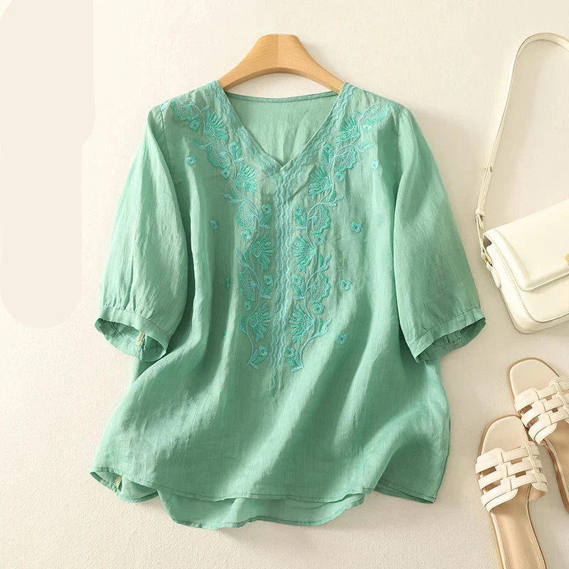 FJØRNA women's cotton blouse with V-neck, lightweight and breathable tops, featuring a relaxed fit and stylish design.