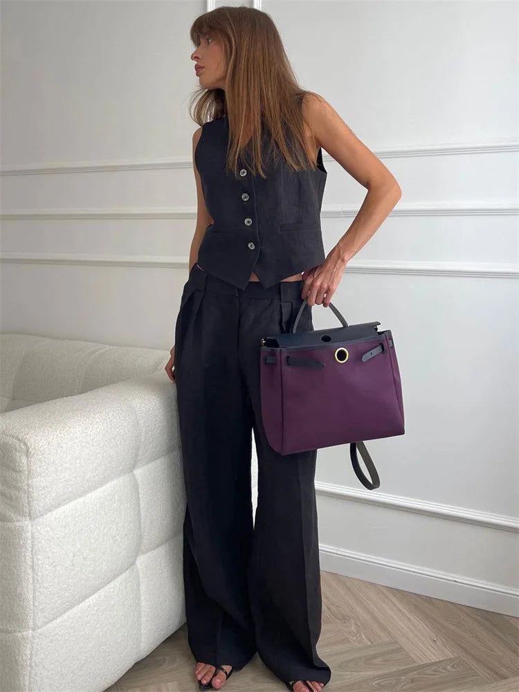 FJØRNA women's linen wide-leg trousers, part of co-ord set, shown in natural beige fabric, relaxed fit and stylish design