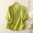 FJØRNA women's cotton V-neck blouse featuring a relaxed fit, soft fabric, and classic design, perfect for casual or office wear.