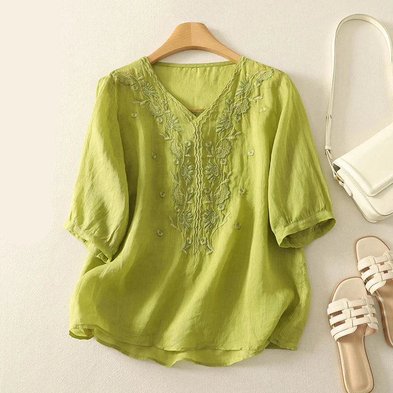 FJØRNA women's cotton V-neck blouse featuring a relaxed fit, soft fabric, and classic design, perfect for casual or office wear.