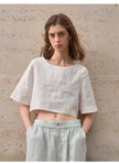 FJØRNA linen crop top for women with short sleeves, casual and breathable summer top, shown in natural fabric and light color