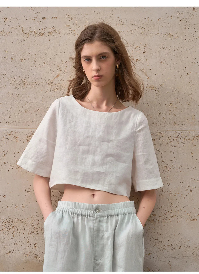 FJØRNA women's linen crop top with short sleeves, lightweight and breathable for casual summer wear.