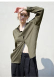 FJØRNA women's linen shirt, lightweight and breathable top, displayed on a hanger with a relaxed fit and natural fabric texture.