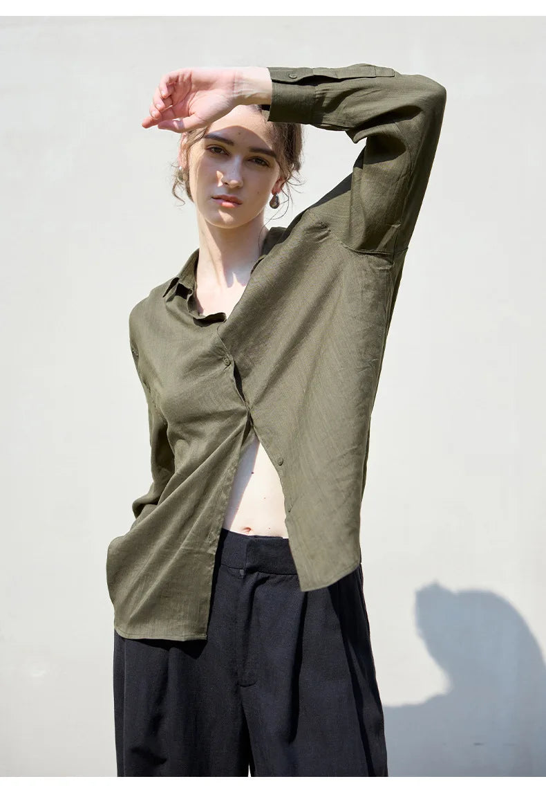 FJØRNA women's linen shirt, lightweight and breathable top, displayed on a hanger with a relaxed fit and natural fabric texture.