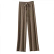 FJØRNA women’s merino wool wide-leg high-waist trousers, stylish and comfortable pants with a tailored fit, displayed on a model.
