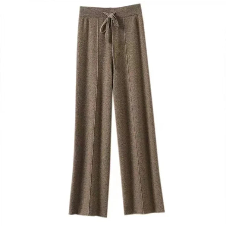 FJØRNA women’s merino wool wide-leg high-waist trousers, stylish and comfortable pants with a tailored fit, displayed on a model.
