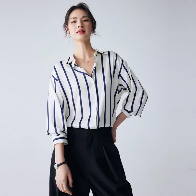 Lacceti Maren Stripe Satin Blouse featuring a stylish striped pattern and smooth satin fabric, displayed on a hanger.