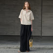 FJØRNA linen polo blouse for women with open collar, casual top featuring lightweight, breathable fabric and relaxed fit.