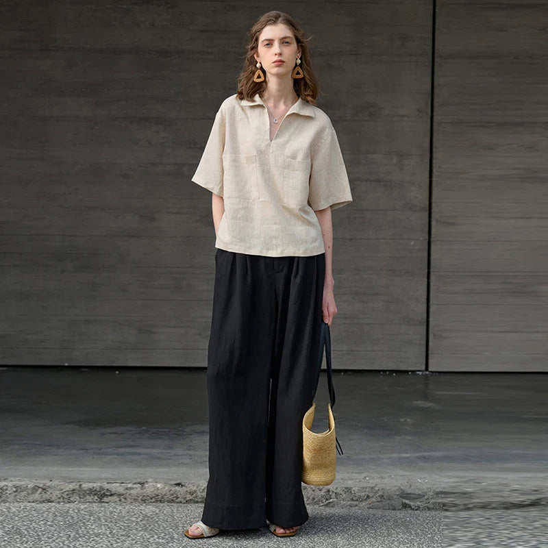 FJØRNA linen polo blouse for women with open collar, casual top featuring lightweight, breathable fabric and relaxed fit.