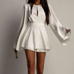 White FJØRNA mini dress, stylish sleeveless dress with a fitted silhouette, perfect for casual or dressy occasions.