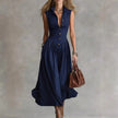 FJØRNA Martina elegant flowy midi dress in soft fabric, with a flattering silhouette and delicate design, perfect for special occasions.