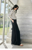 Lacceti Maren Stripe Satin Blouse featuring blue and white stripes, lightweight fabric, and a classic button-up design.