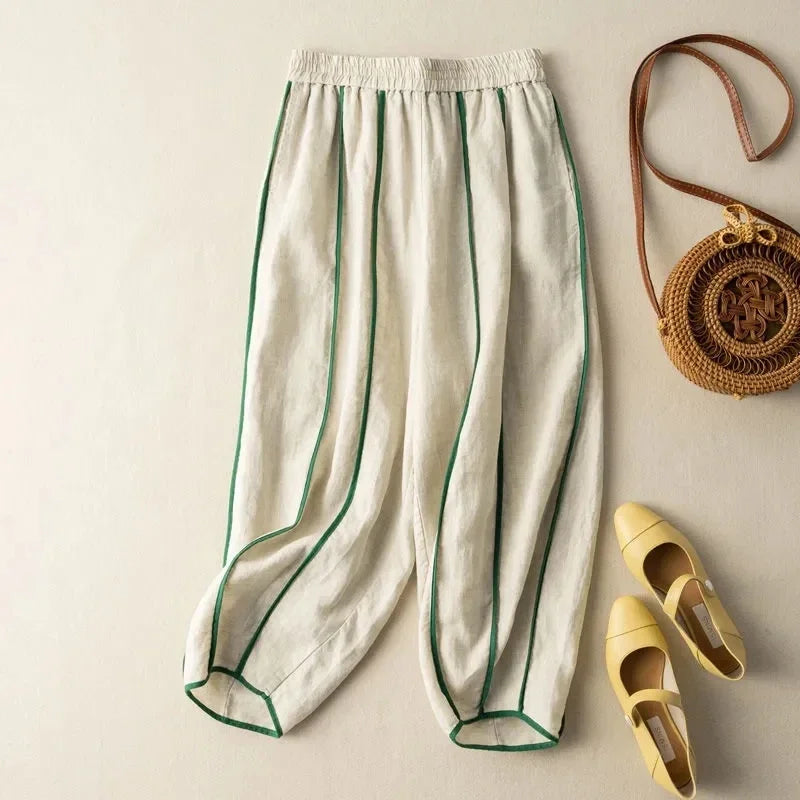 FJØRNA women's linen wide-leg trousers with elastic waist, featuring a relaxed fit and breathable fabric for casual wear.